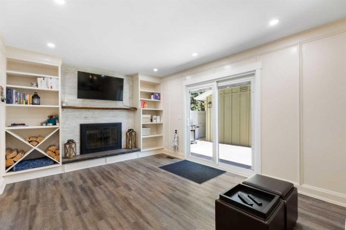 44 Sunmount Crescent Se, Calgary, AB - Indoor Photo Showing Living Room With Fireplace