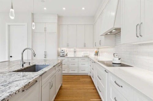23 Elveden Park Sw, Calgary, AB - Indoor Photo Showing Kitchen With Upgraded Kitchen