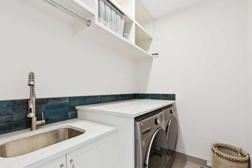 23 Elveden Park Sw, Calgary, AB - Indoor Photo Showing Laundry Room