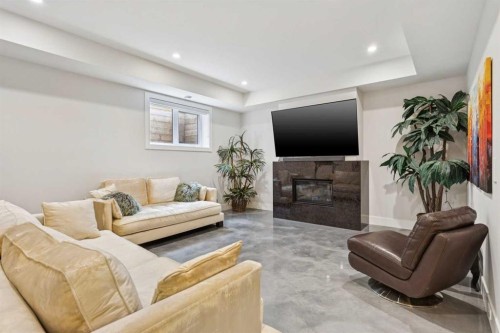 23 Elveden Park Sw, Calgary, AB - Indoor Photo Showing Living Room With Fireplace