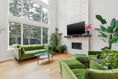 23 Elveden Park Sw, Calgary, AB - Indoor Photo Showing Living Room With Fireplace
