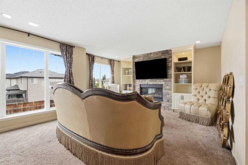 160 Brightoncrest Manor Se, Calgary, AB - Indoor Photo Showing Living Room With Fireplace