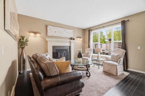 160 Brightoncrest Manor Se, Calgary, AB - Indoor Photo Showing Living Room With Fireplace