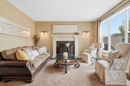 160 Brightoncrest Manor Se, Calgary, AB - Indoor Photo Showing Living Room With Fireplace