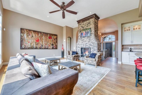 16 Heaver Gate, Rural Foothills County, AB - Indoor Photo Showing Living Room With Fireplace