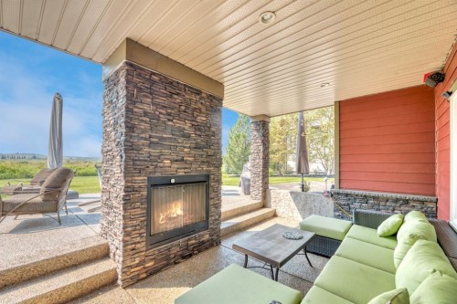 16 Heaver Gate, Rural Foothills County, AB - Indoor Photo Showing Living Room With Fireplace