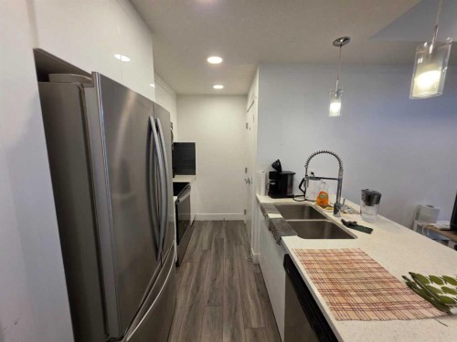 14 Savanna Passage Ne, Calgary, AB - Indoor Photo Showing Kitchen With Stainless Steel Kitchen With Double Sink With Upgraded Kitchen