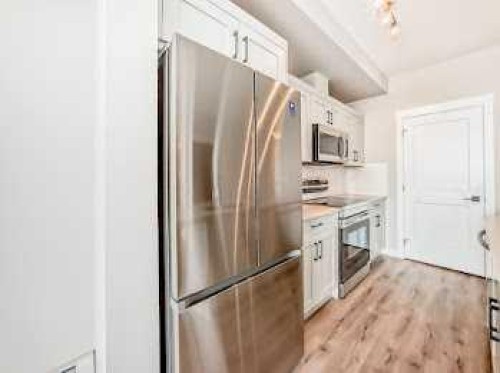 110-30 Sage Hill Walk Nw, Calgary, AB - Indoor Photo Showing Kitchen With Stainless Steel Kitchen