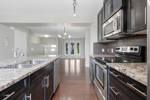 1404 Auburn Bay Square, Calgary, AB - Indoor Photo Showing Kitchen With Double Sink With Upgraded Kitchen