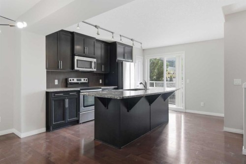 1404 Auburn Bay Square, Calgary, AB - Indoor Photo Showing Kitchen With Upgraded Kitchen