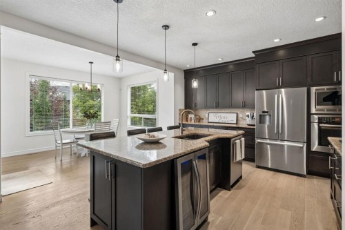 46 Aspenshire Place Sw, Calgary, AB - Indoor Photo Showing Kitchen With Stainless Steel Kitchen With Upgraded Kitchen