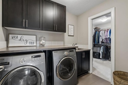 46 Aspenshire Place Sw, Calgary, AB - Indoor Photo Showing Laundry Room