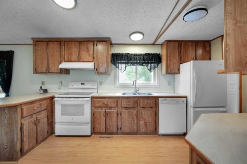 169 Erin Woods Circle Se, Calgary, AB - Indoor Photo Showing Kitchen With Double Sink