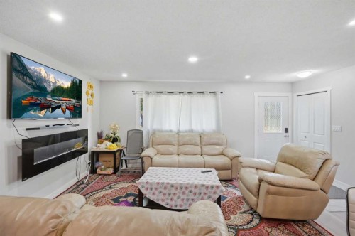 731 Maryvale Way Ne, Calgary, AB - Indoor Photo Showing Living Room With Fireplace