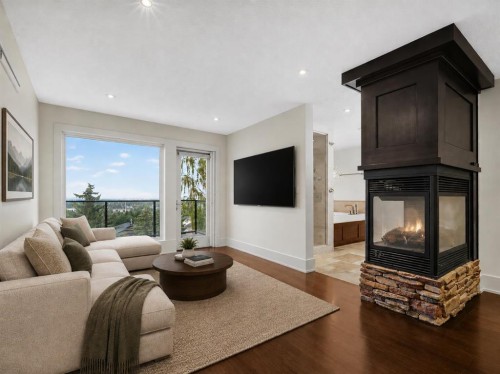 2724 Signal Ridge View Sw, Calgary, AB - Indoor Photo Showing Living Room With Fireplace