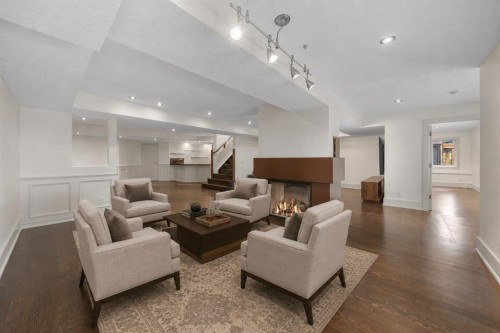 2724 Signal Ridge View Sw, Calgary, AB - Indoor Photo Showing Living Room With Fireplace