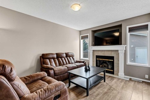 152 Covewood Green Ne, Calgary, AB - Indoor Photo Showing Living Room With Fireplace