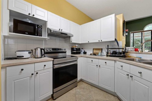 5036 Martin Crossing Drive Ne, Calgary, AB - Indoor Photo Showing Kitchen With Double Sink
