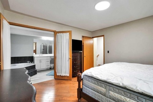 16 Sun Harbour Crescent Se, Calgary, AB - Indoor Photo Showing Bedroom
