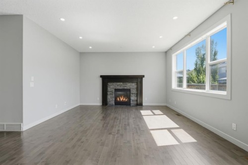7 Copperleaf Terrace Se, Calgary, AB - Indoor Photo Showing Living Room With Fireplace