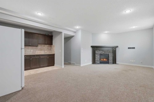 7 Copperleaf Terrace Se, Calgary, AB - Indoor With Fireplace