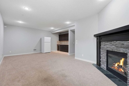 7 Copperleaf Terrace Se, Calgary, AB - Indoor Photo Showing Living Room With Fireplace