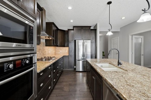 7 Copperleaf Terrace Se, Calgary, AB - Indoor Photo Showing Kitchen With Stainless Steel Kitchen With Double Sink With Upgraded Kitchen