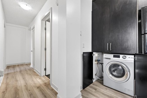 103-1333 13 Avenue Sw, Calgary, AB - Indoor Photo Showing Laundry Room