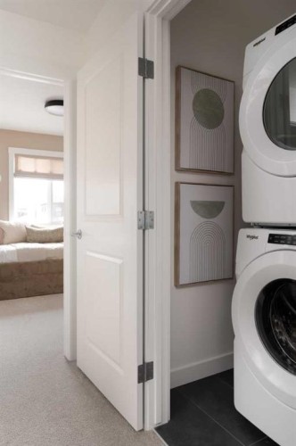 198 Starling Boulevard Nw, Calgary, AB - Indoor Photo Showing Laundry Room