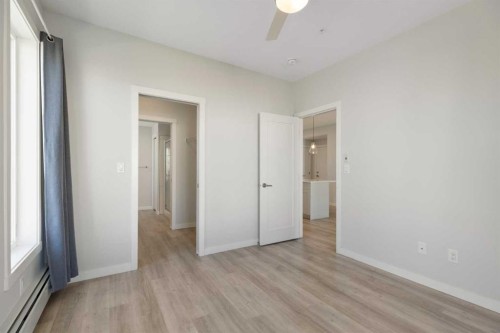 202-150 Shawnee Square Sw, Calgary, AB - Indoor Photo Showing Other Room