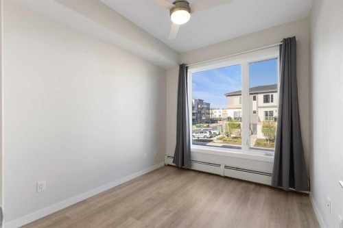 202-150 Shawnee Square Sw, Calgary, AB - Indoor Photo Showing Other Room