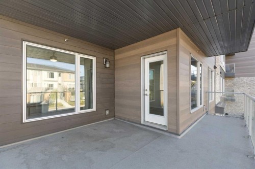 202-150 Shawnee Square Sw, Calgary, AB - Outdoor With Balcony With Exterior