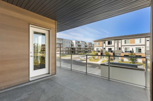202-150 Shawnee Square Sw, Calgary, AB - Outdoor With Balcony With Exterior