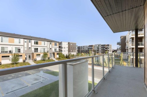 202-150 Shawnee Square Sw, Calgary, AB - Outdoor With Balcony With Exterior