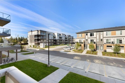 202-150 Shawnee Square Sw, Calgary, AB - Outdoor With Balcony
