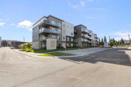 202-150 Shawnee Square Sw, Calgary, AB - Outdoor With Balcony With Facade