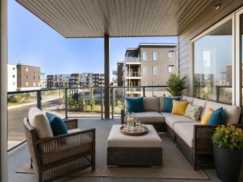 202-150 Shawnee Square Sw, Calgary, AB - Outdoor With Balcony With Exterior