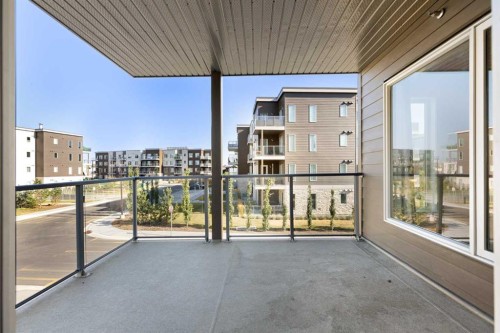 202-150 Shawnee Square Sw, Calgary, AB - Outdoor With Balcony With Exterior