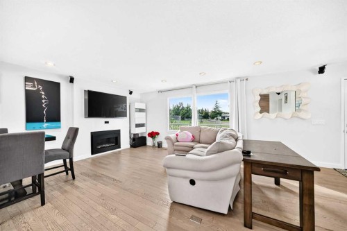 1376 Lake Sylvan Drive Se, Calgary, AB - Indoor Photo Showing Living Room With Fireplace