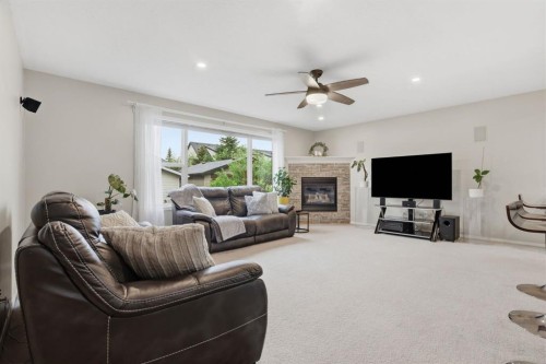 450 Elgin Way Se, Calgary, AB - Indoor Photo Showing Living Room With Fireplace