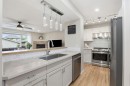 450 Elgin Way Se, Calgary, AB  - Indoor Photo Showing Living Room With Fireplace 