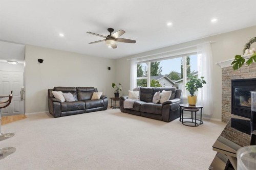 450 Elgin Way Se, Calgary, AB - Indoor Photo Showing Living Room With Fireplace