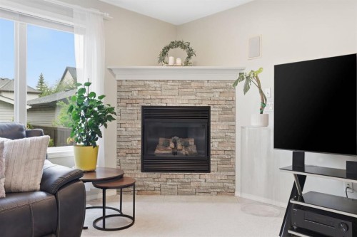 450 Elgin Way Se, Calgary, AB - Indoor Photo Showing Living Room With Fireplace