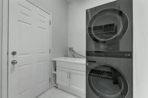 100 Fairways Drive Nw, Airdrie, AB - Indoor Photo Showing Laundry Room