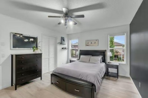 100 Fairways Drive Nw, Airdrie, AB - Indoor Photo Showing Bedroom