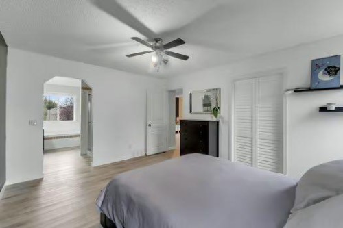 100 Fairways Drive Nw, Airdrie, AB - Indoor Photo Showing Bedroom