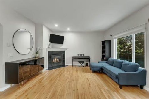 100 Fairways Drive Nw, Airdrie, AB - Indoor With Fireplace