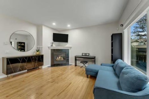 100 Fairways Drive Nw, Airdrie, AB - Indoor With Fireplace