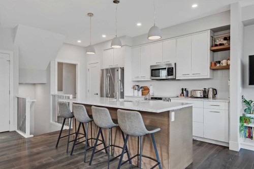 2-1936 25A Street Sw, Calgary, AB - Indoor Photo Showing Kitchen With Upgraded Kitchen