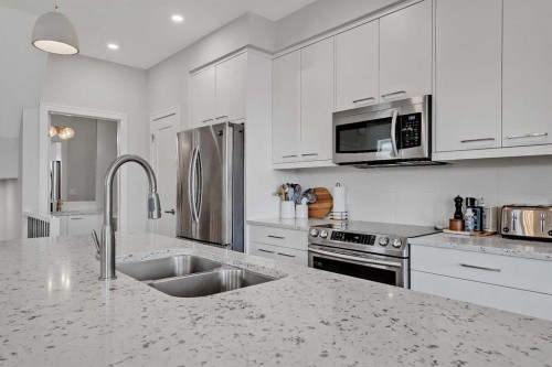 2-1936 25A Street Sw, Calgary, AB - Indoor Photo Showing Kitchen With Stainless Steel Kitchen With Double Sink With Upgraded Kitchen